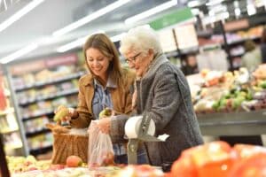 Elderly woman with young woman shopping