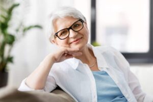 portrait of smiling senior woman with glasses