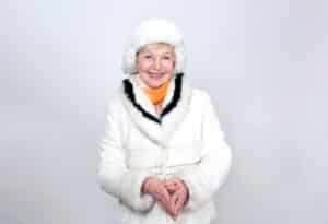 Smiling senior woman dressed in winter outerwear