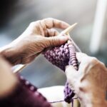 Close-up of senior crocheting